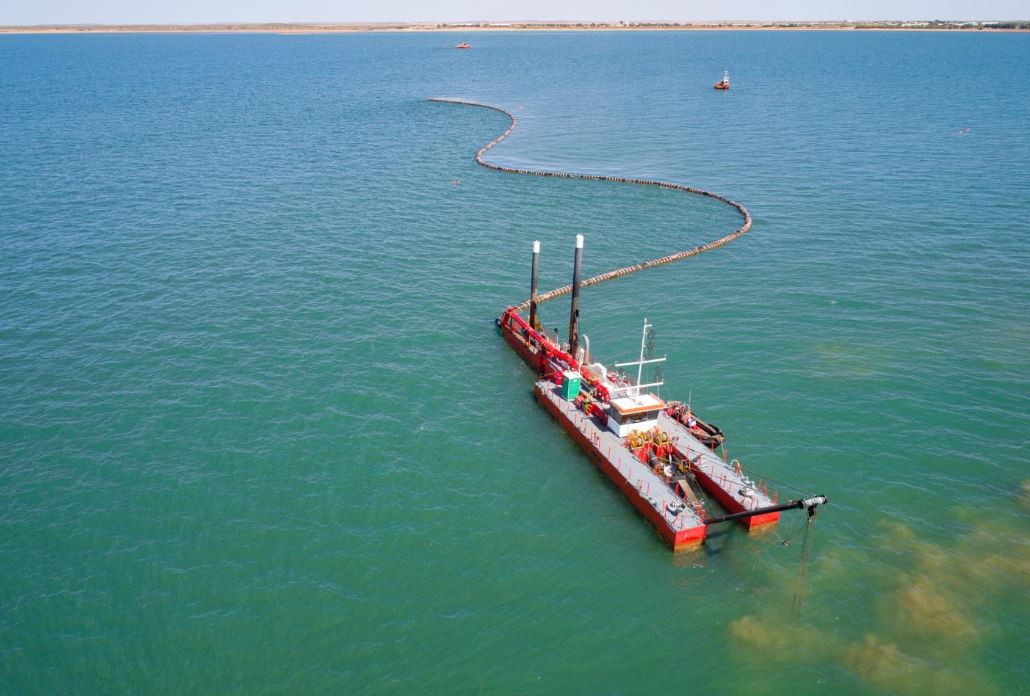 define dredging on beaches