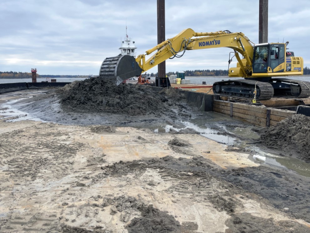 Excavator removing sediment from the Hay River