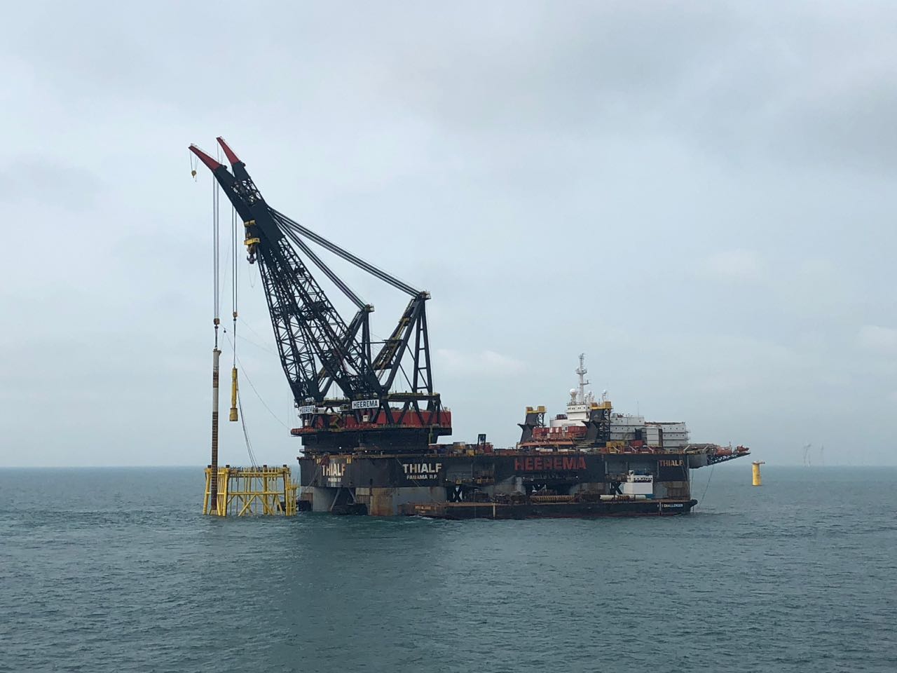 A photo of the SSCV vessel Thialf installing EnbW Hohe See substation jacket