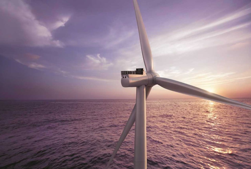 A close-up photo of Siemens Gamesa's offshore wind turbine at sea in sunset