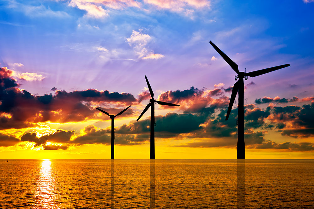 Image showing wind turbine silhouettes at sunset