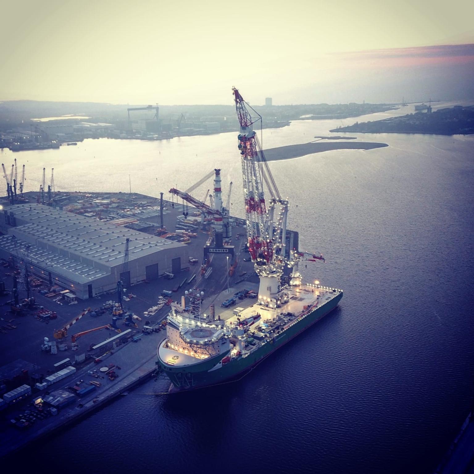 Photo of DEME's vessel Orion with the lifted crane