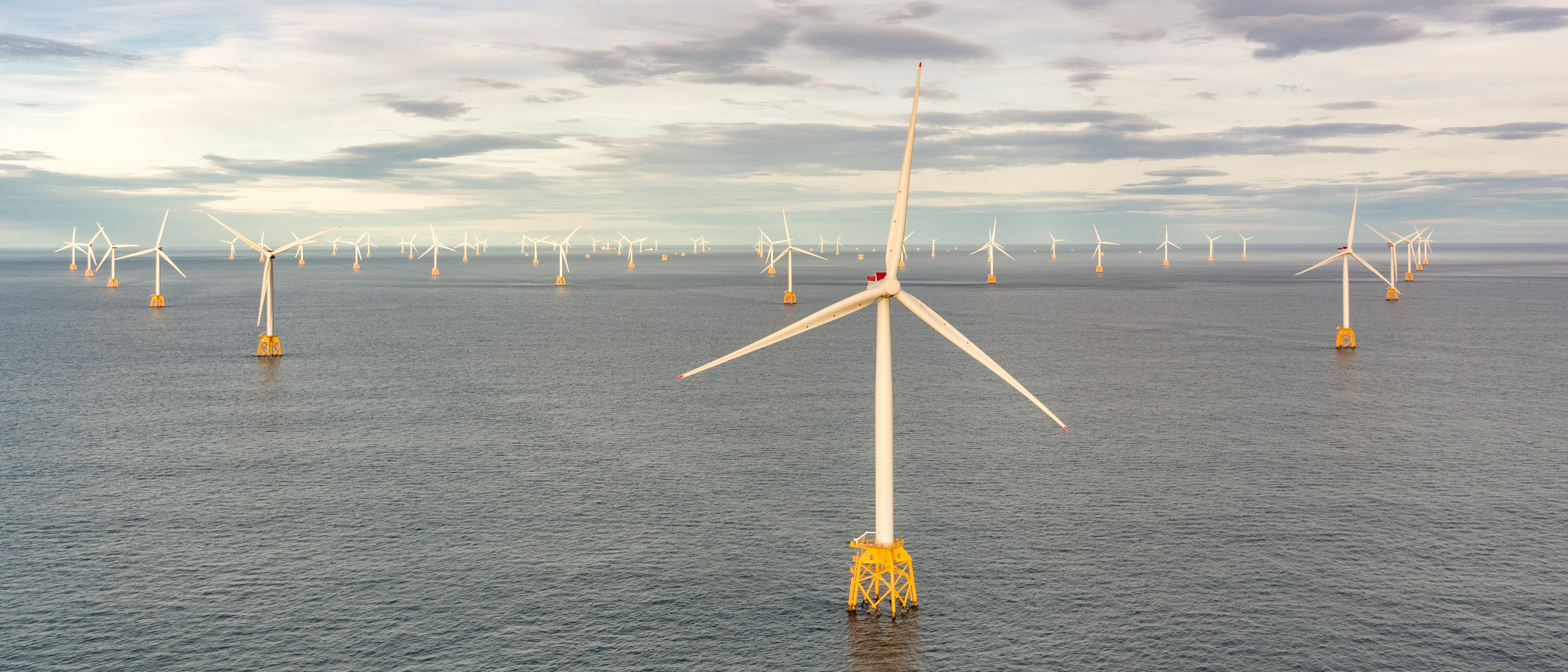 An illustration photo showing wind turbines at sea on jacket foundations