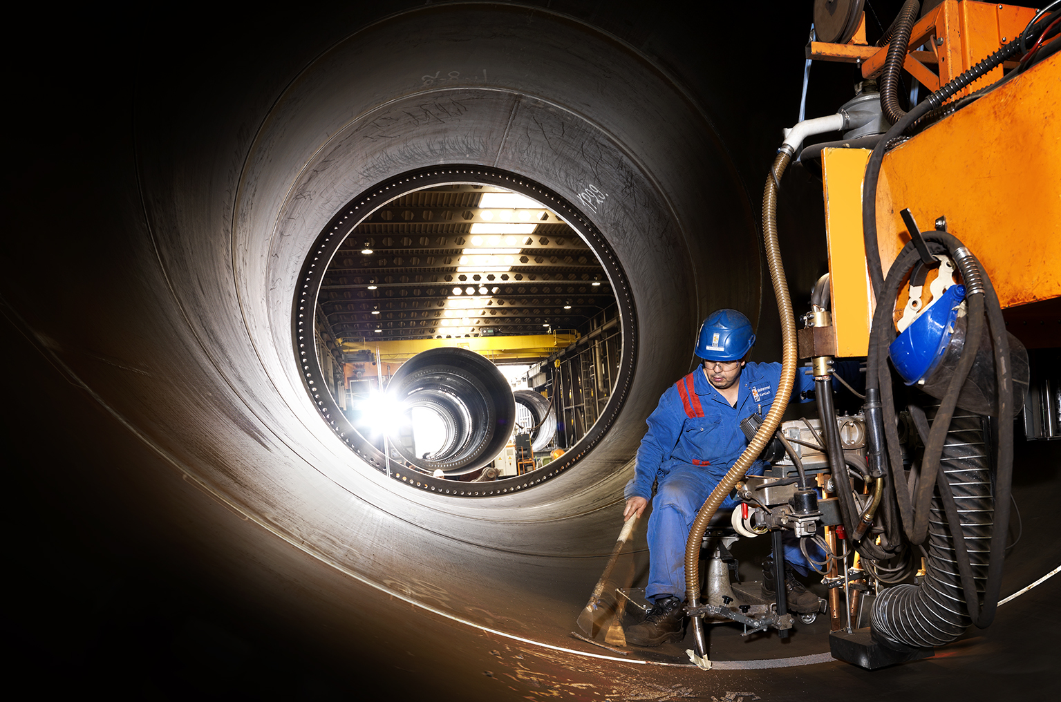 A photo of a Sif worker carrying our circumferential welding inside a monopile