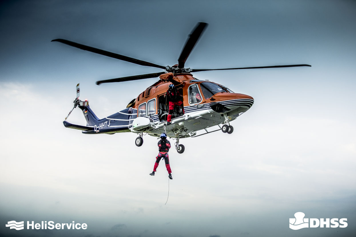 A photo of a helicopter during hoisting operation