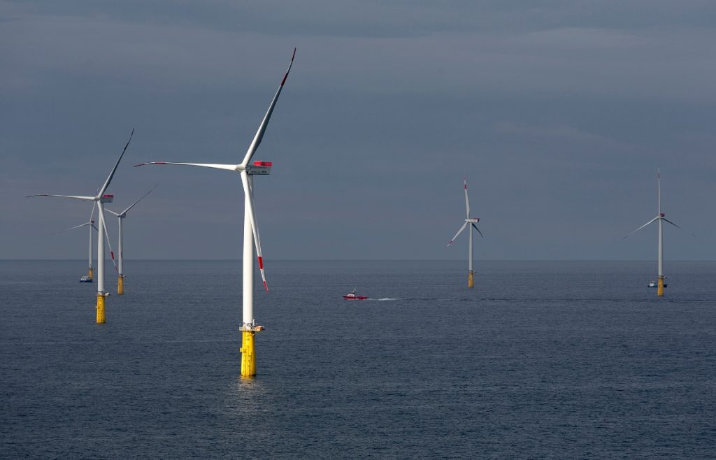 A photo of a Vattenfall offshore wind farm with a crew transfer vessel on site