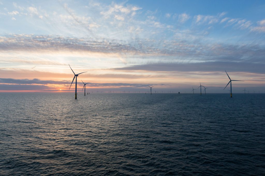 An offshore wind farm in sunset