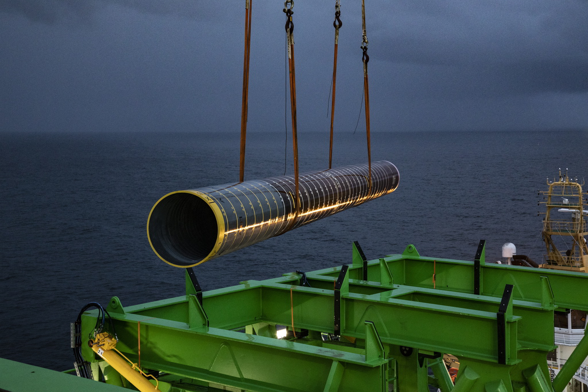 A photo of a pile being handled offshore for a DEME vessel