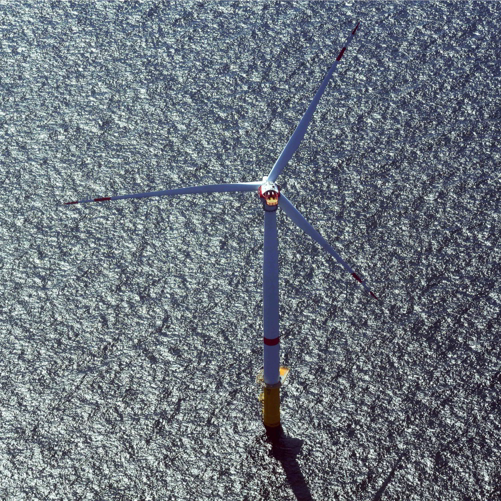An aerial photo of one of the offshore wind turbine at the Merkur wind farm site