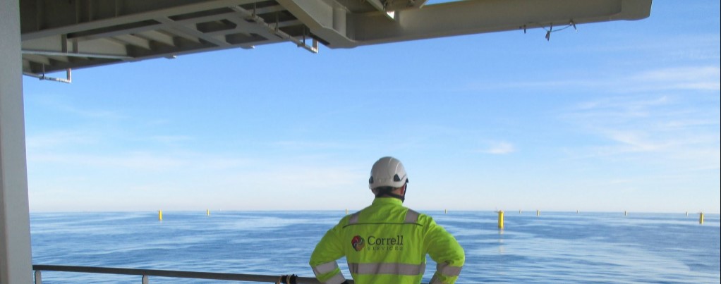 A photo of a Correlle Services' worker at an offshore wind farm