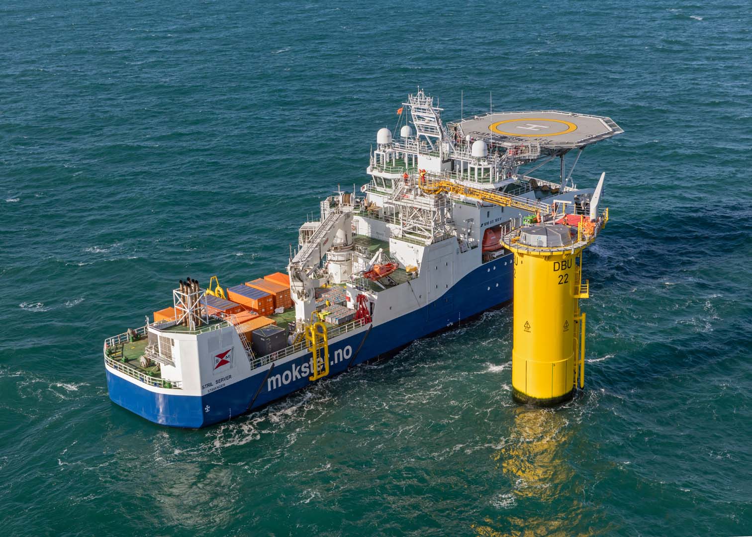 A photo of the Stril Server vessel at an offshore wind turbine foundation