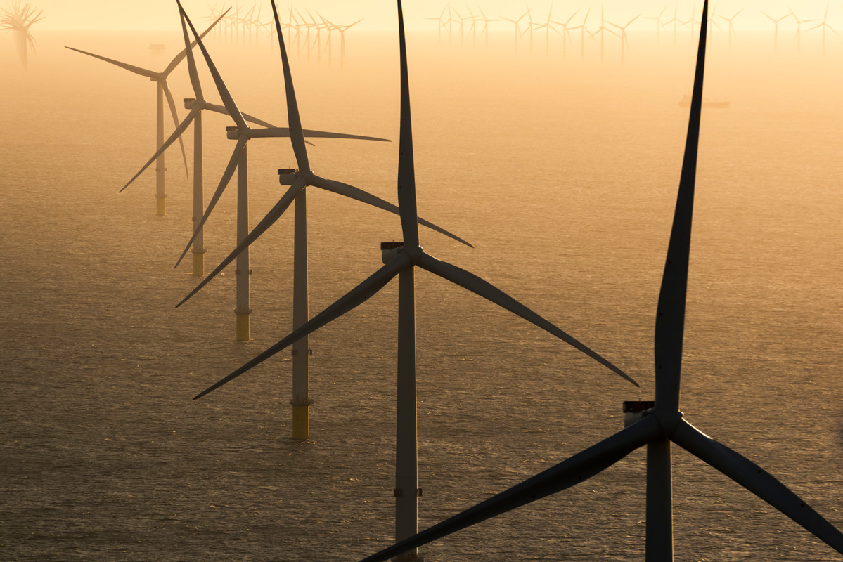 A photo of an offshore wind farm with Vestas wind turbines