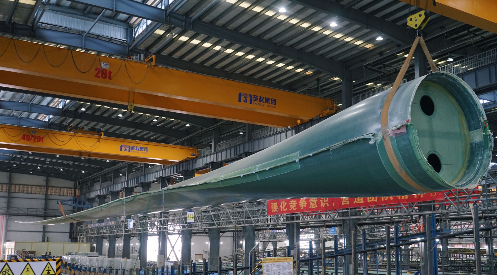 A photo of the first MySE 11-99A1 blade for the MySE 11MM-203 wind turbine rolled off the production line at the Guangdong Shanwei offshore blade production facility.