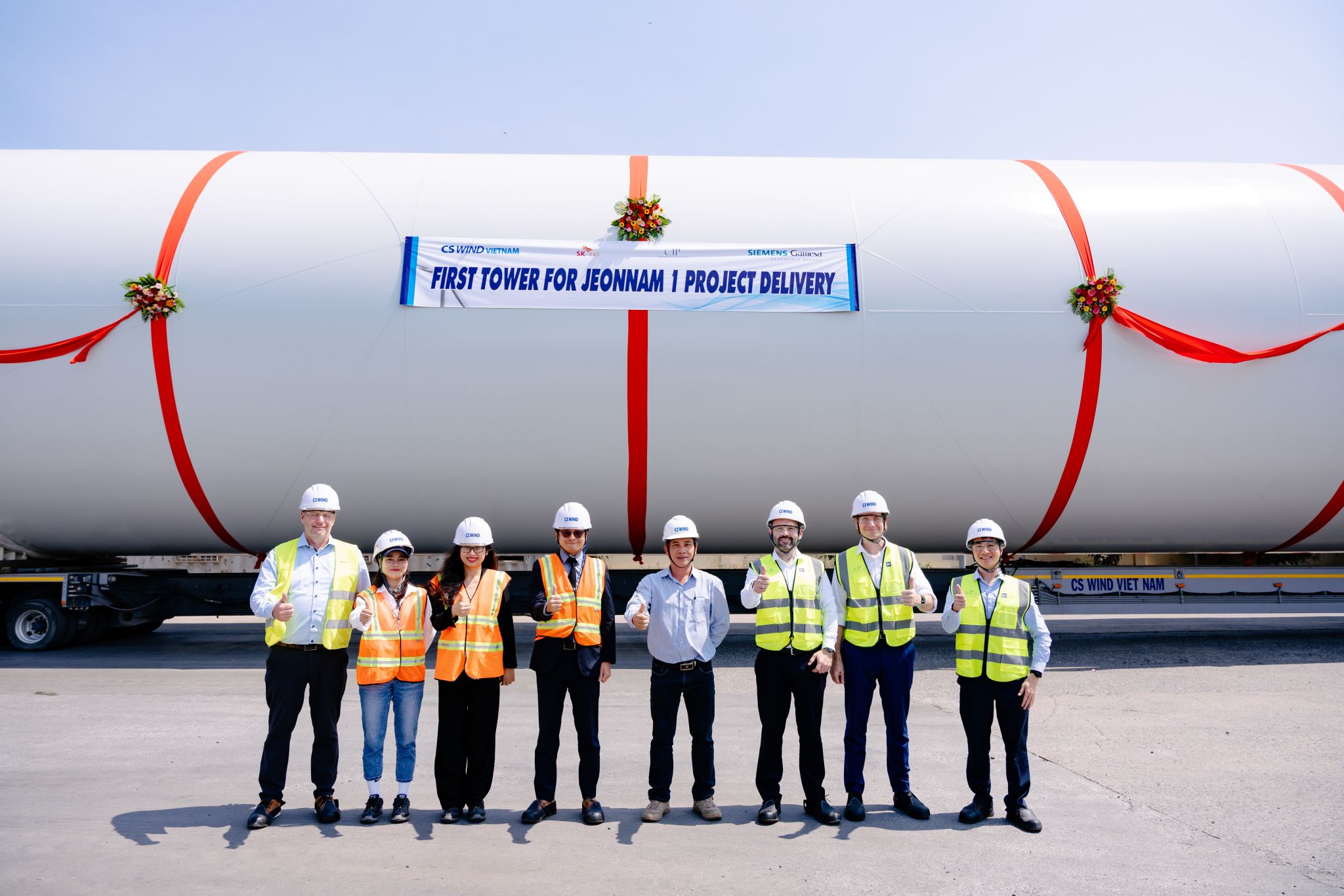 A photo of CS Wind's first tower for Jeonnam I offshore wind farm with CIP, COP and CS Wind team in front