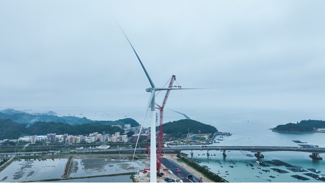 An aerial photo of Dongfang Electric Corporation's 18 MW turbine being installed at the coastal test base in China