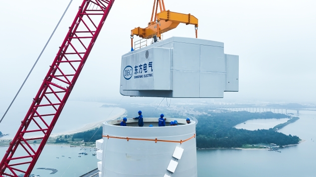 An aerial photo of nacelle installation for Dongfang Electric Corporation's 18 MW turbine at the coastal test base in China