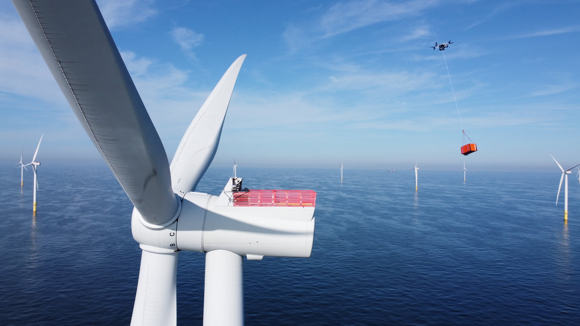 An aerial photo of a heavy-lift cargo drone at a Borssele 1&2 offshore wind turbine