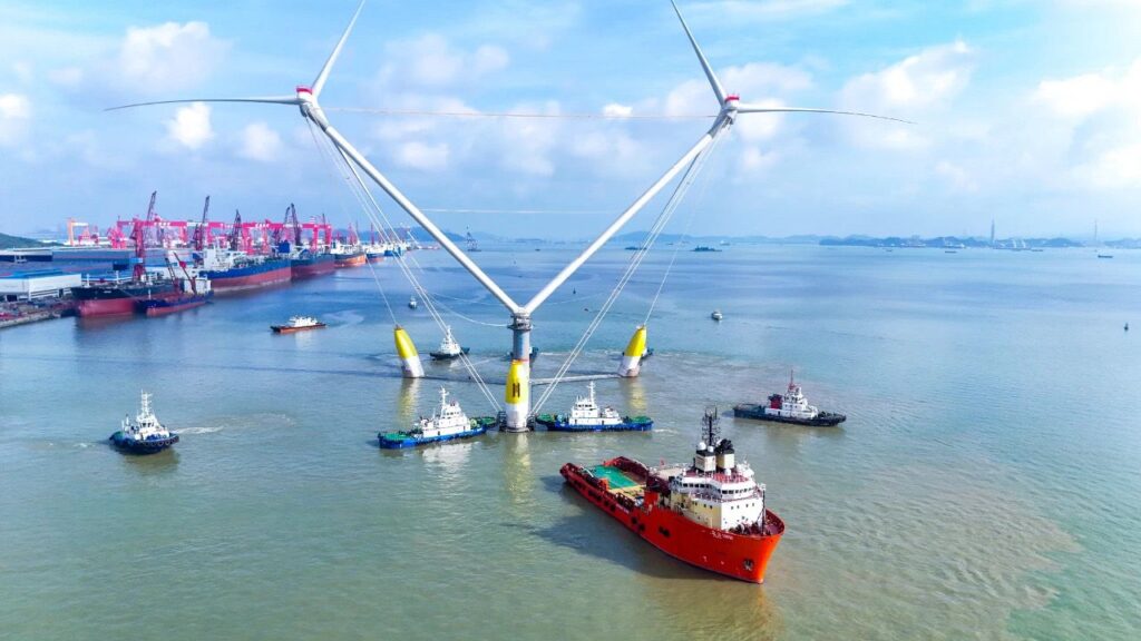 OceanX floating wind turbine sailing out of Guangzhou