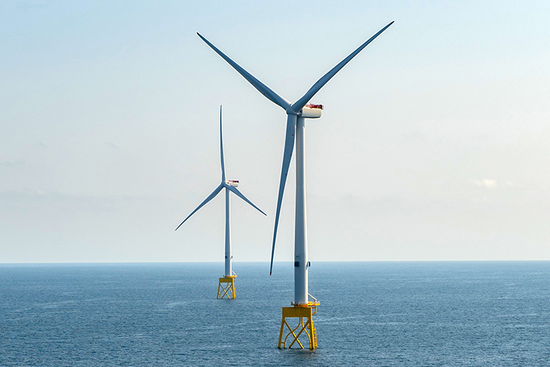 A photo of two wind turbines at the Seagreen 1 offshore wind farm site