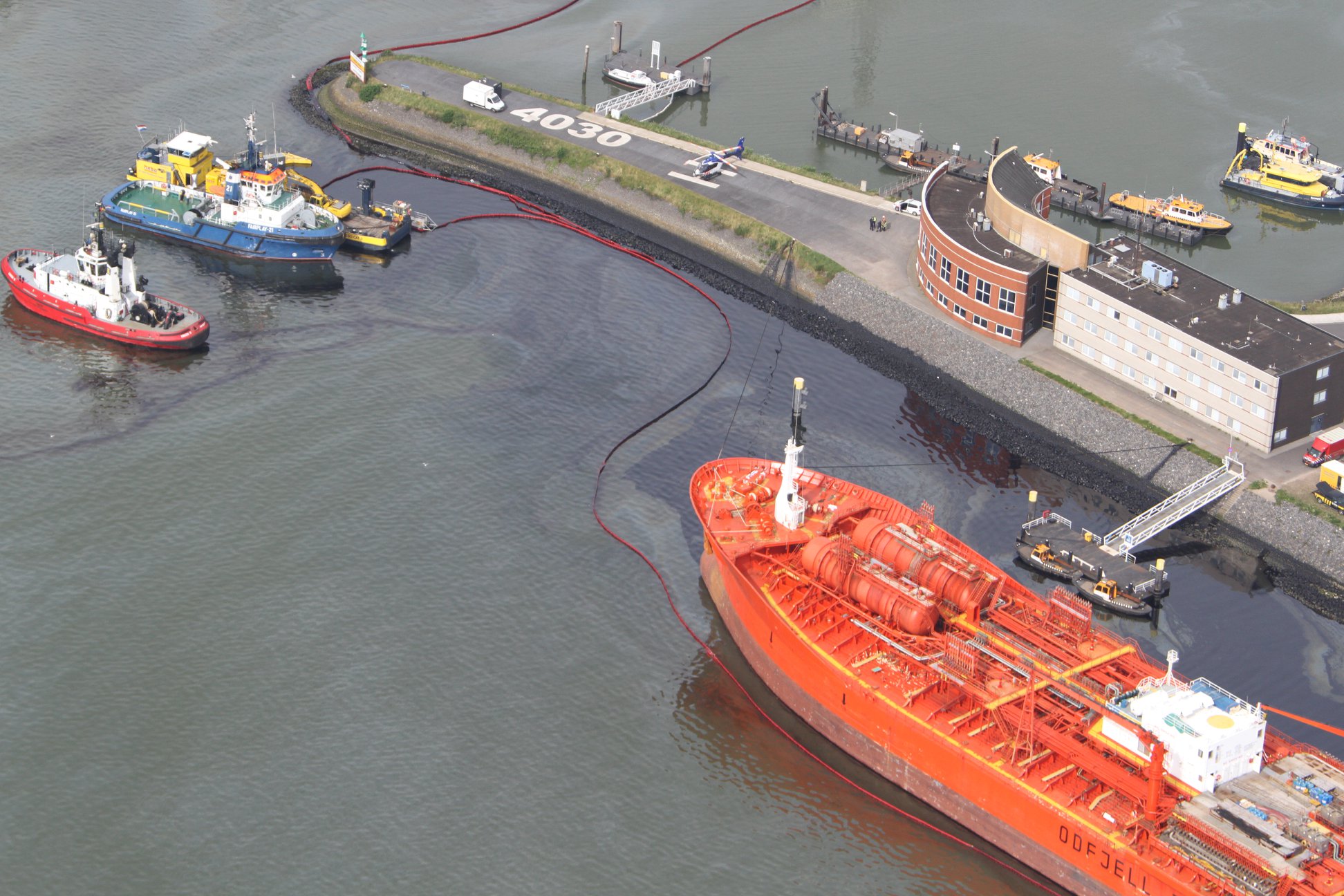 Oil spill after tanker collides with jetty