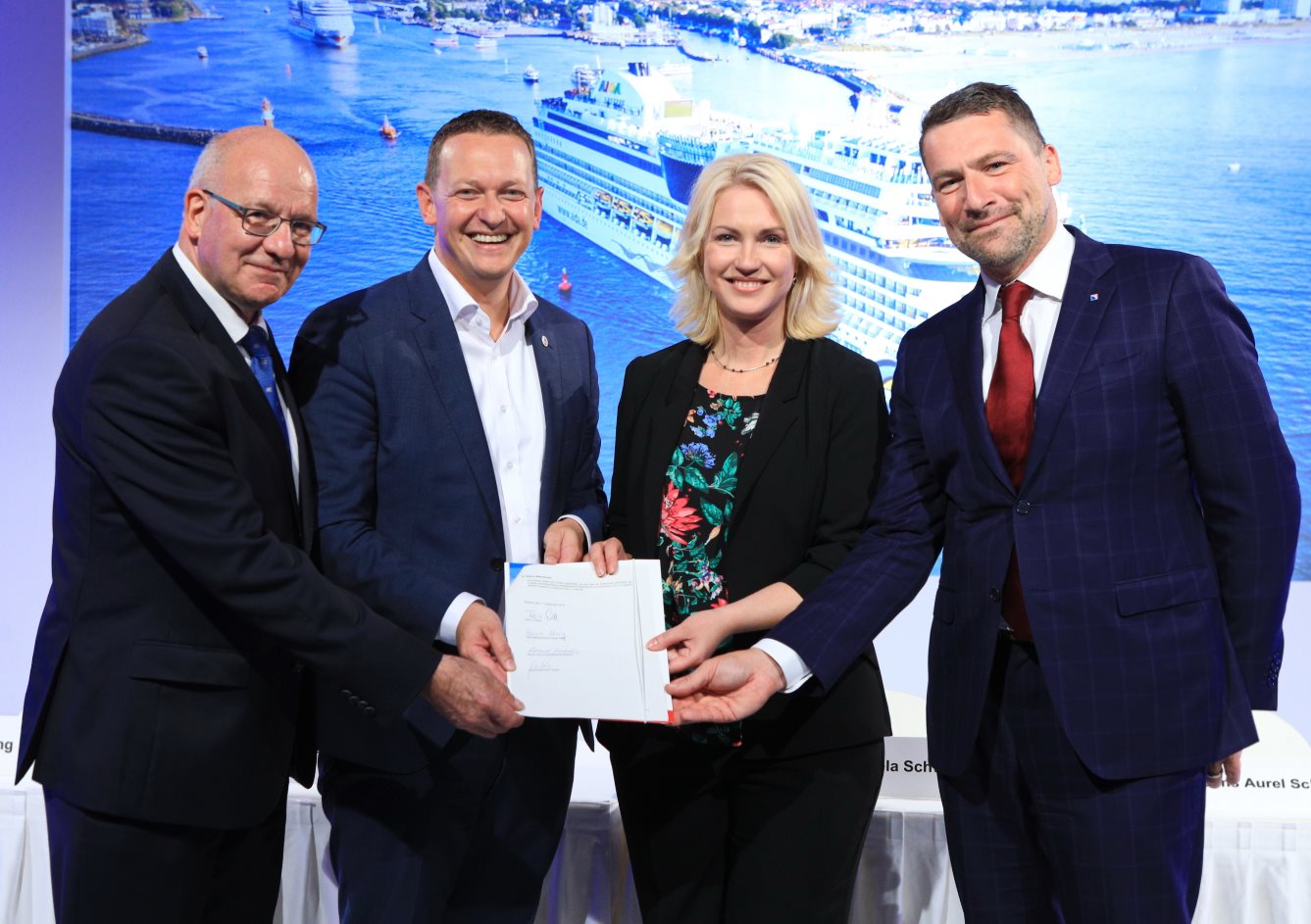 (from left) Rostock's Lord Mayor Roland Methling, AIDA President Felix Eichhorn, Prime Minister Manuela Schwesig and Rostock's port chief Jens Aurel Scharner signed an agreement to promote environmentally friendly cruise tourism in Rostock.