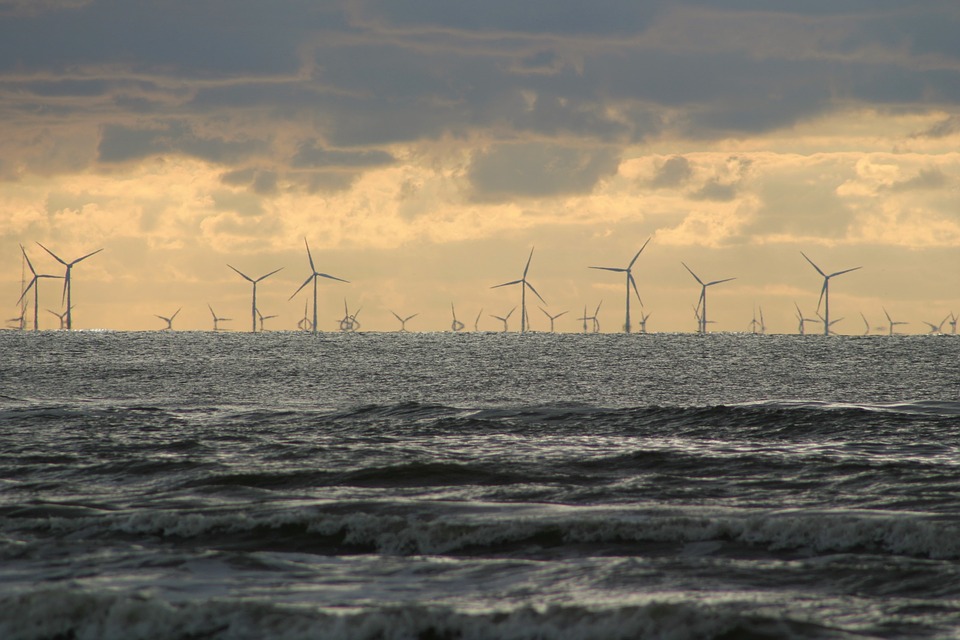 A photo for illustration only, showing wind turbines at sea in the distance