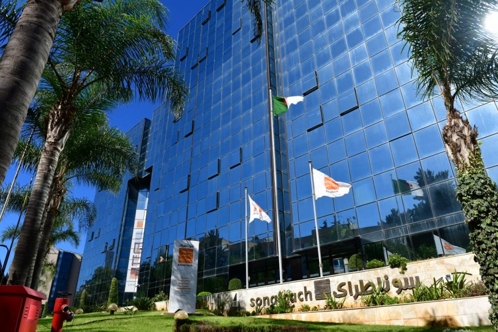 Sonatrach and Algerian flags outside of Sonatrach building