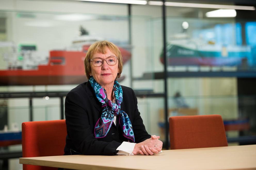 GIEK CEO Wenche Nistad sitting at a conference desk