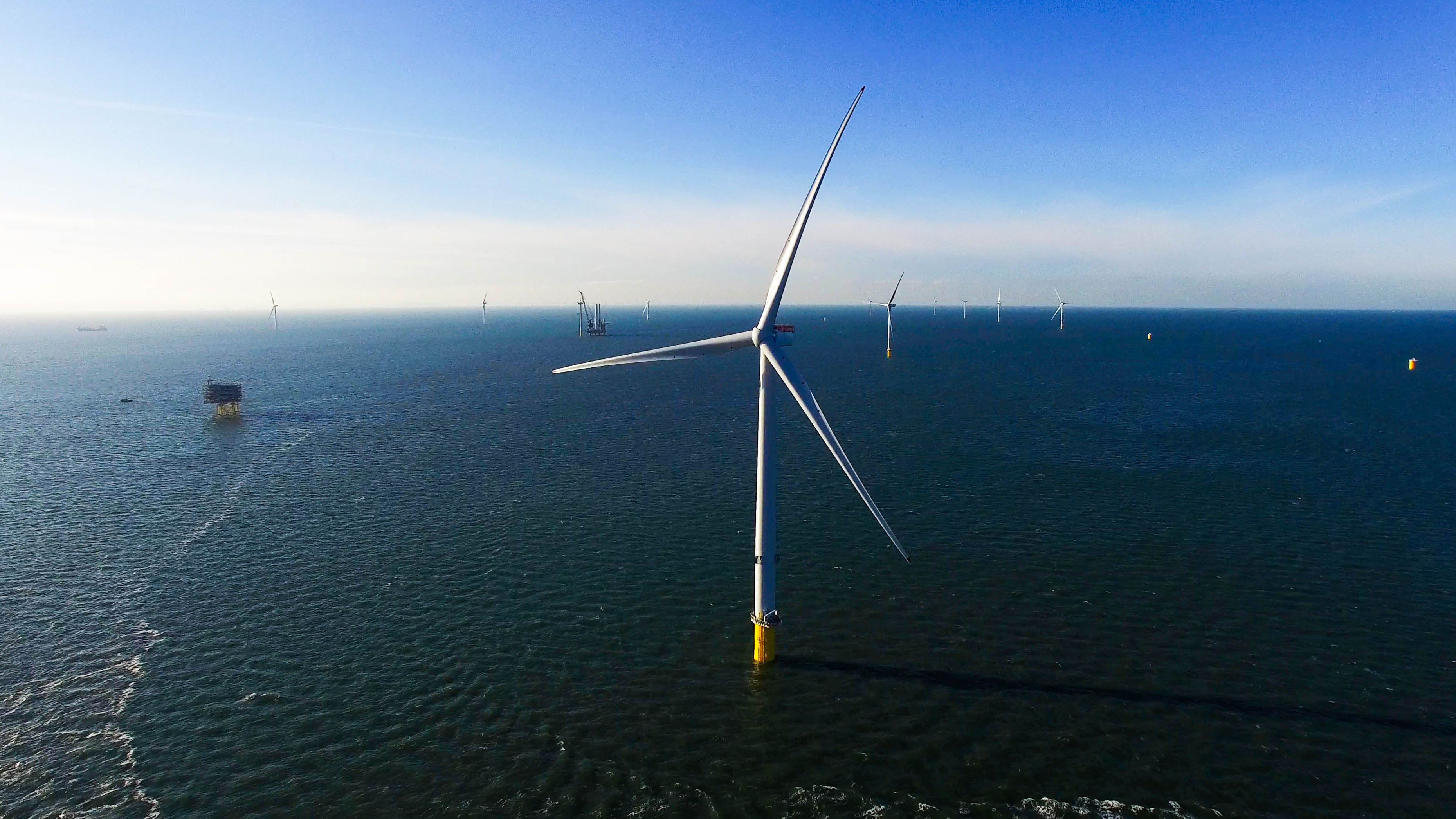 Ørsted offshore wind farm Burbo Bank Extension with one wind turbine in the centre of photograph