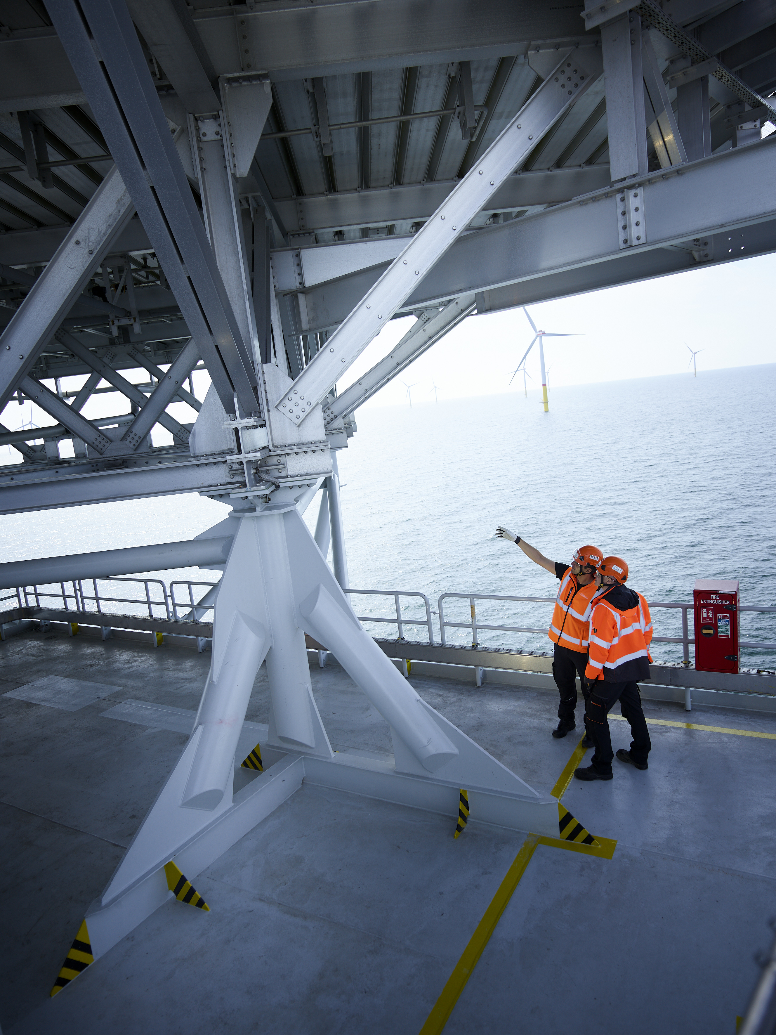 50Hertz employees conducting an inspection on an offshore platform in the Baltic Sea.