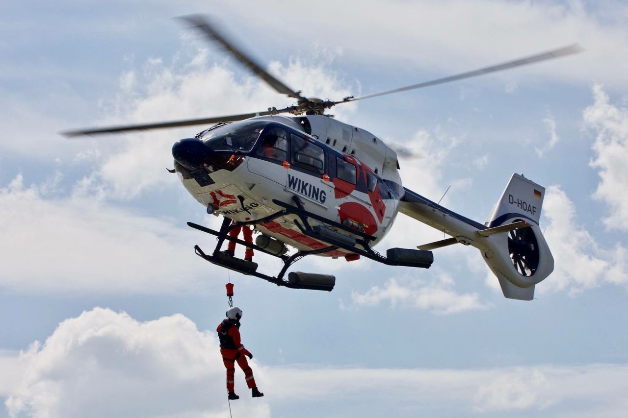 A photo of a Wiking helicopter during hoisting operation