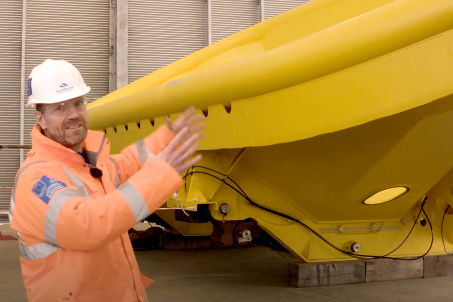 Bombora’s Chief Operating Officer Dave Rigg leads the Assembly Centre tour stopping to explain how the innovative mWave cell module will be covered in a flexible rubber membrane (Screenshot by Bombora)