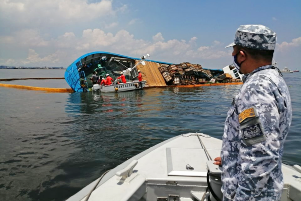 Cargo Ship Spills Oil After Collision With Dredger Off Manila ...