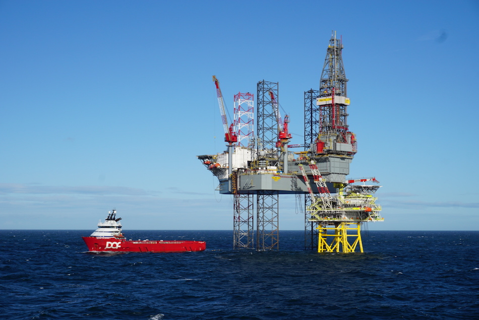 Tolmount platform with a drilling rig and a standby boat - Harbour Energy