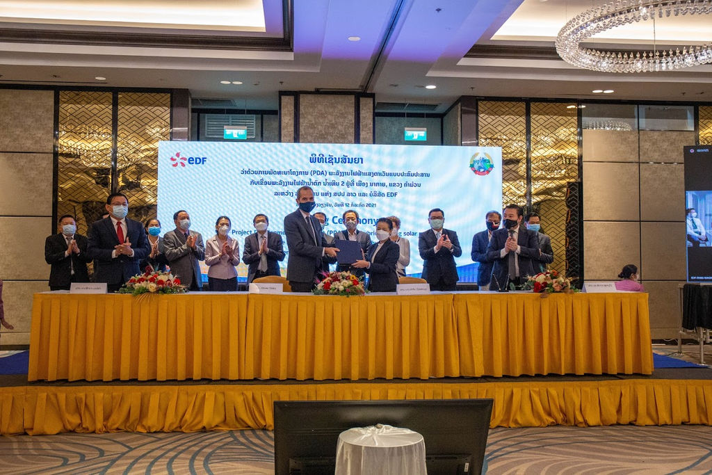 Photo showing the signing of the project development agreement between EDF and Laos officials (Courtesy of NTPC)