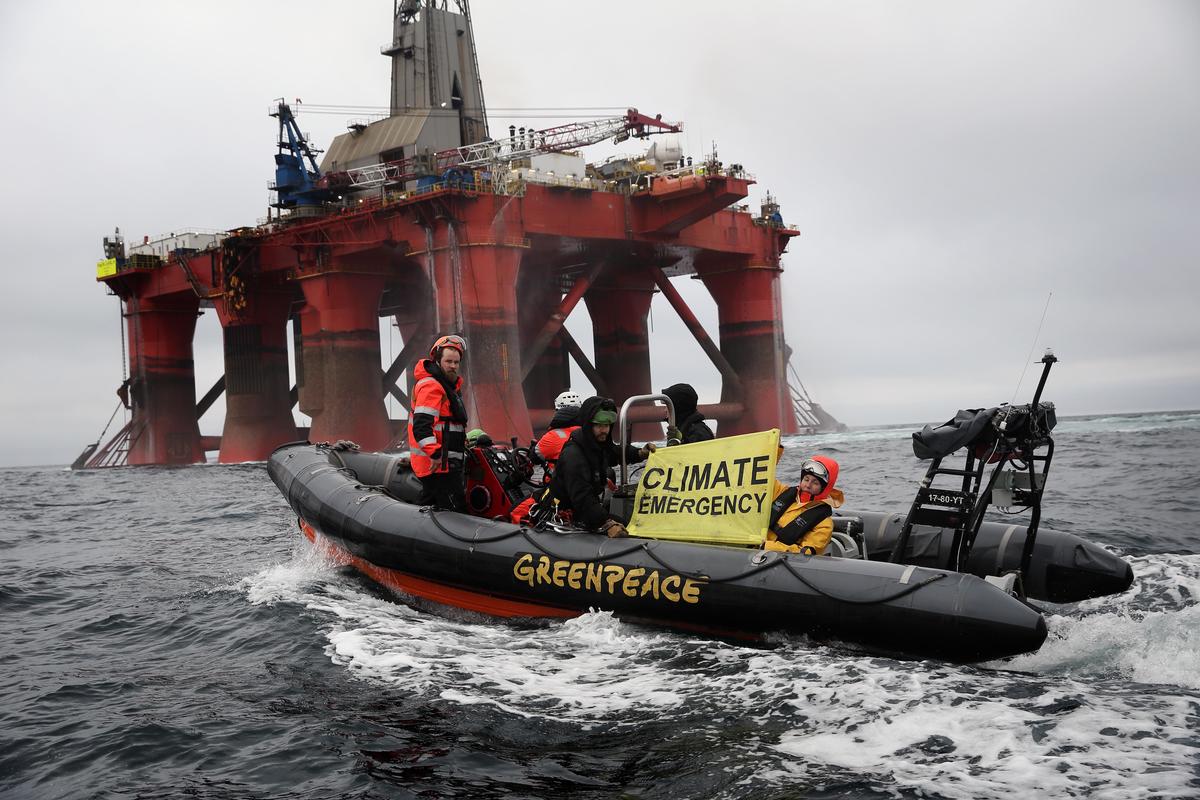 Greenpeace boat alongside the BP-chartered Transocean 'The Paul B Loyd Jr' rig en route to the Vorlich field in the North Sea.