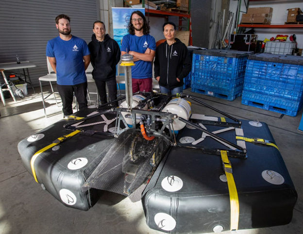 Oneka Technologies team with its wave energy-powered desalination device (Courtesy of US DOE)