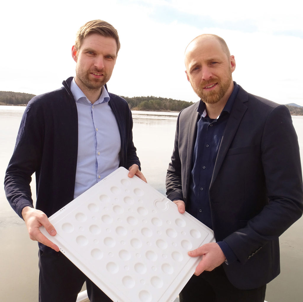 DNV project manager Tore Hordvik (left) and Sunlit Sea CTO Bjørn Hervold Riise (right) with a model of the Sunlit Sea aluminum sheet (Courtesy of DNV)