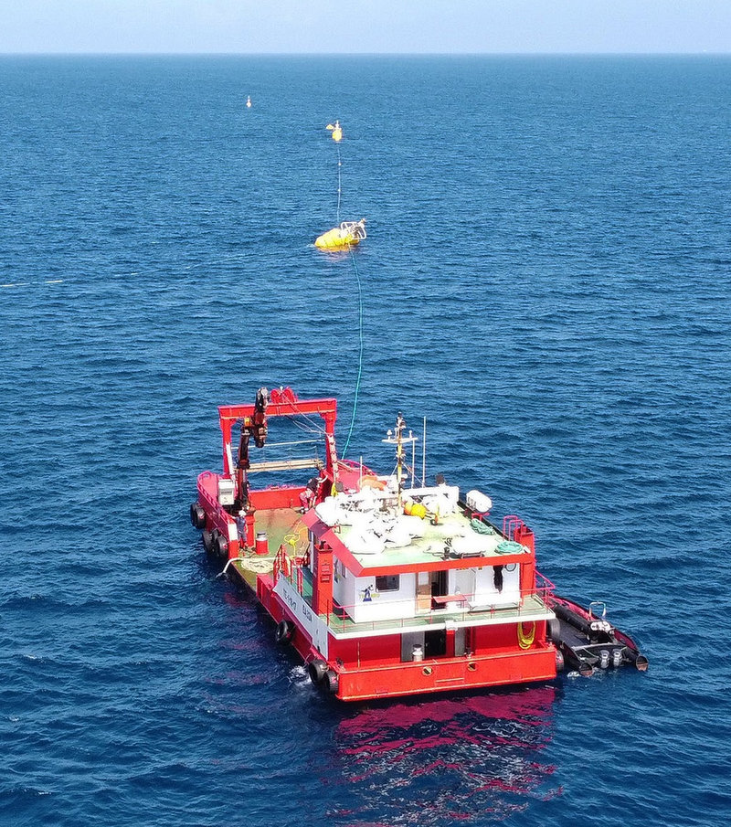 Buoy being installed at sea (Courtesy of Wavepiston)