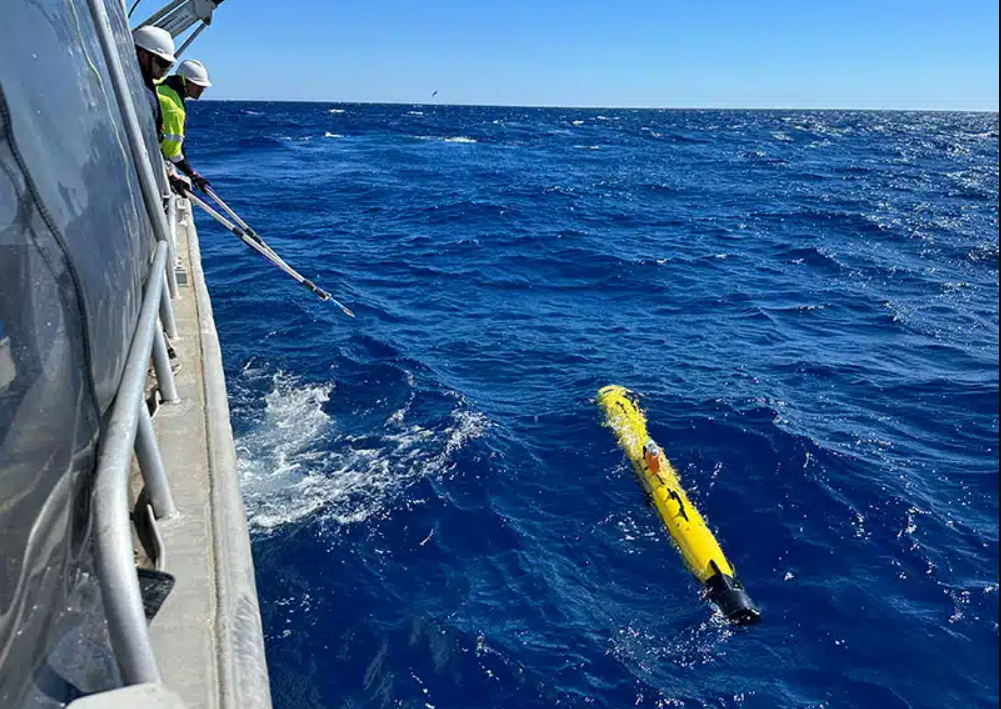 The AUV being deployed for a deepwater trial.