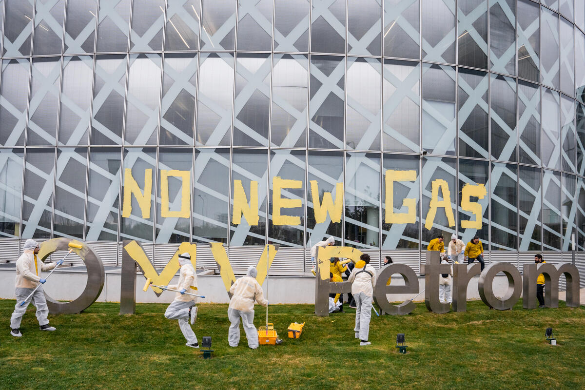 Protesters at OMV Petrom HQ in Bucharest, Romania; Source: Greenpeace