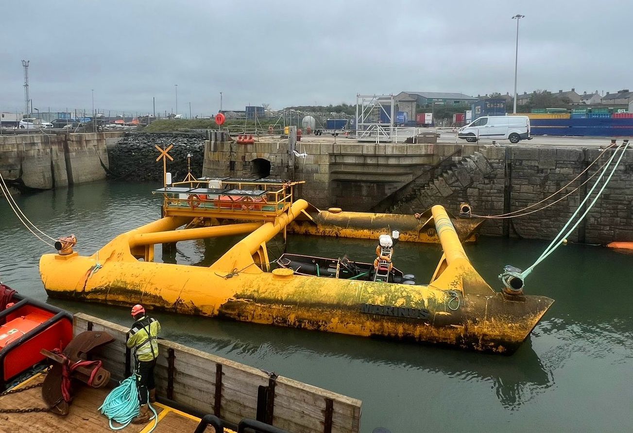 yellow buoy coming back to Holyhead Port for maintenance, after a year at sea.