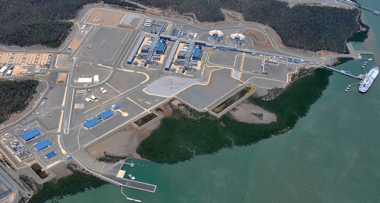 LNG complex on the coast next to a body of water