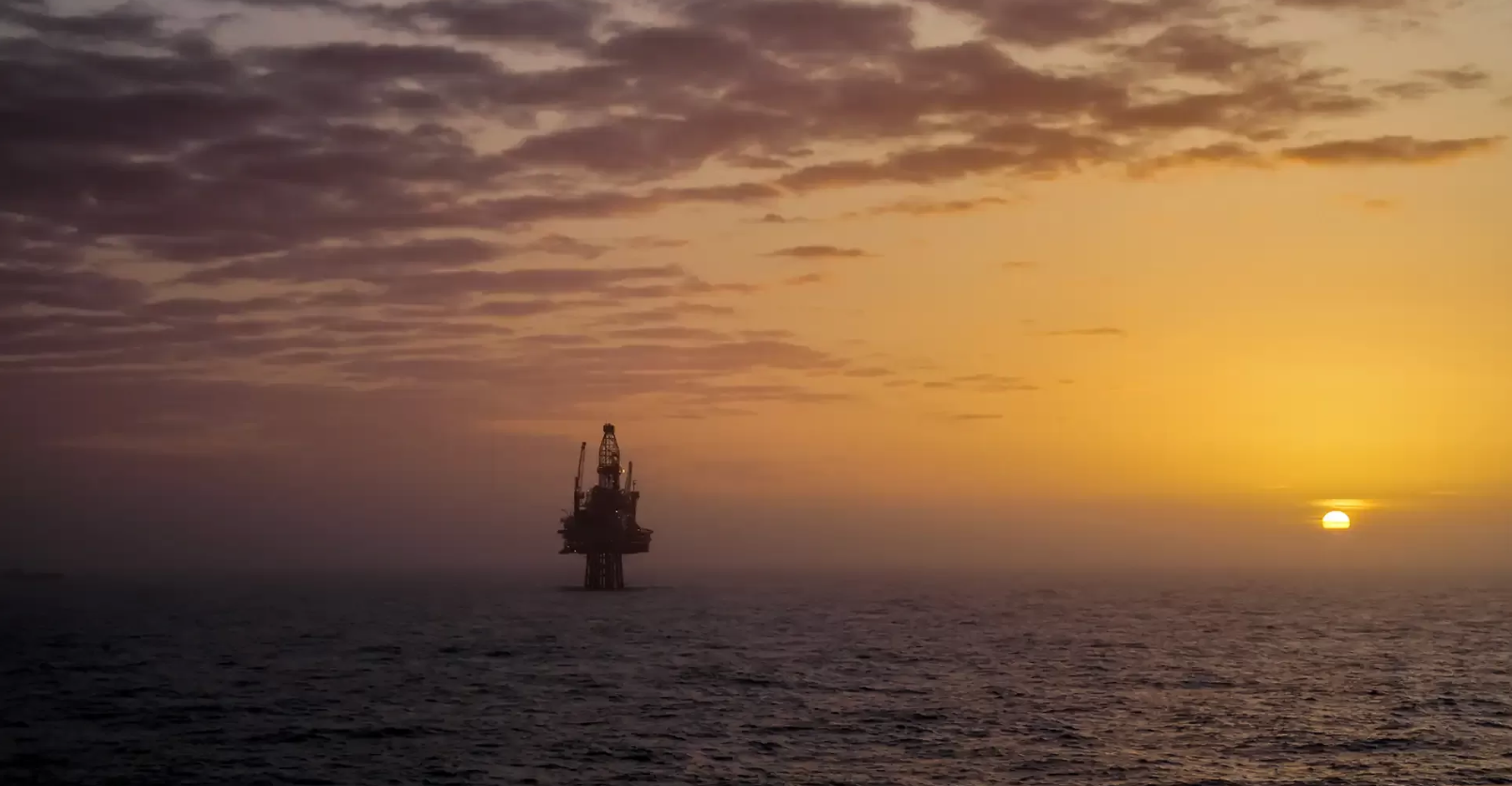 Wood's background image representing a beautiful orange offshore sunset