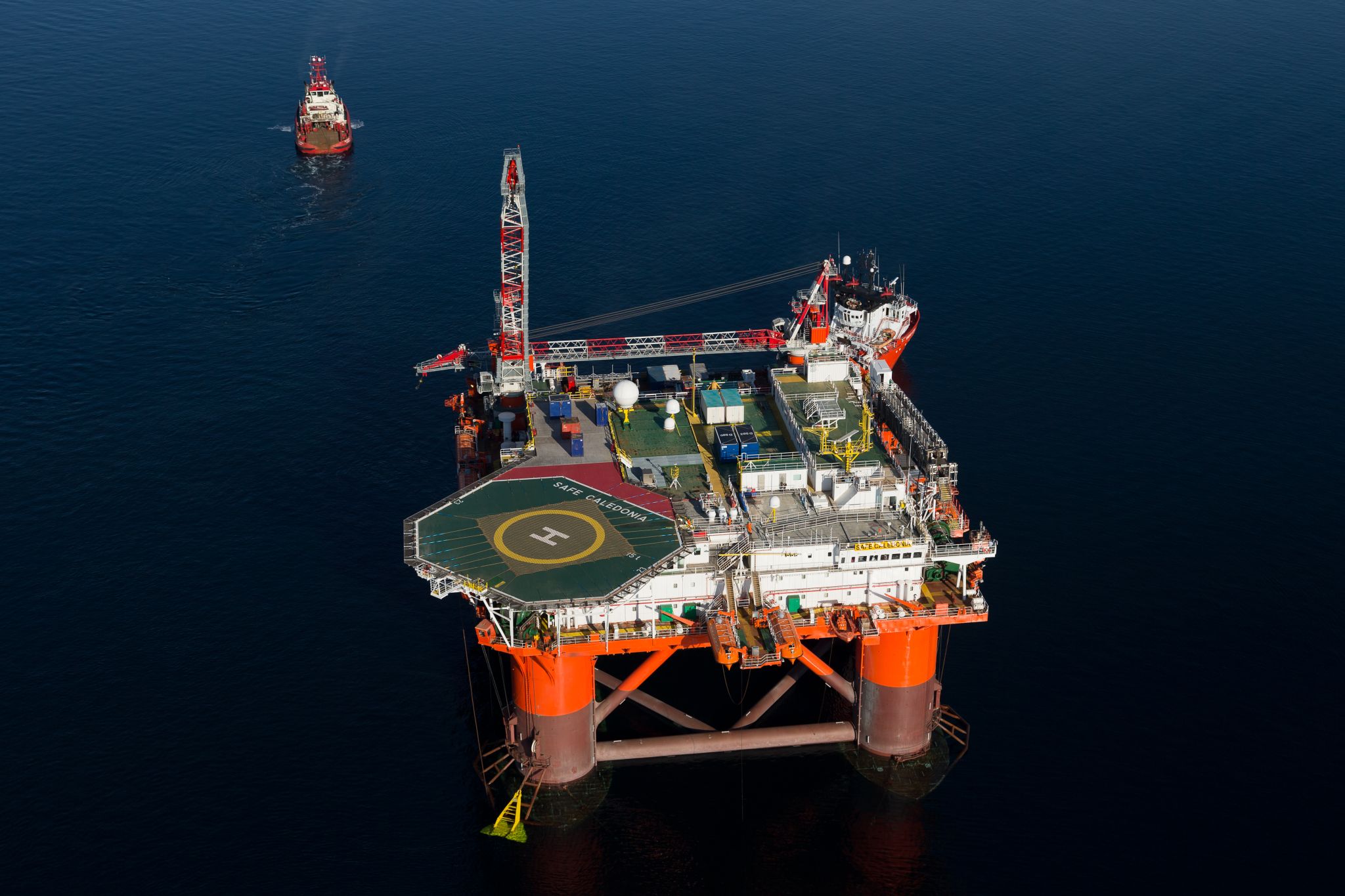 An offshore platform being approached by a small vessel