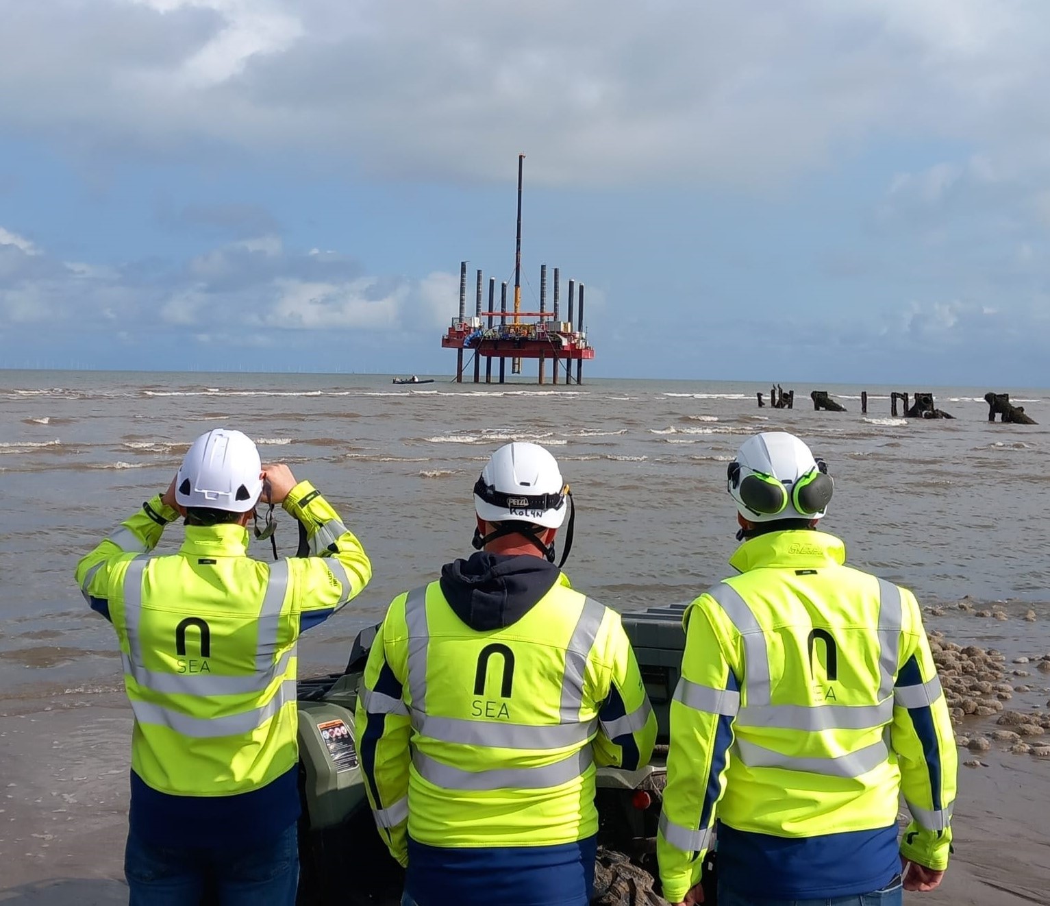 N-Sea workers in their flourescent equipment