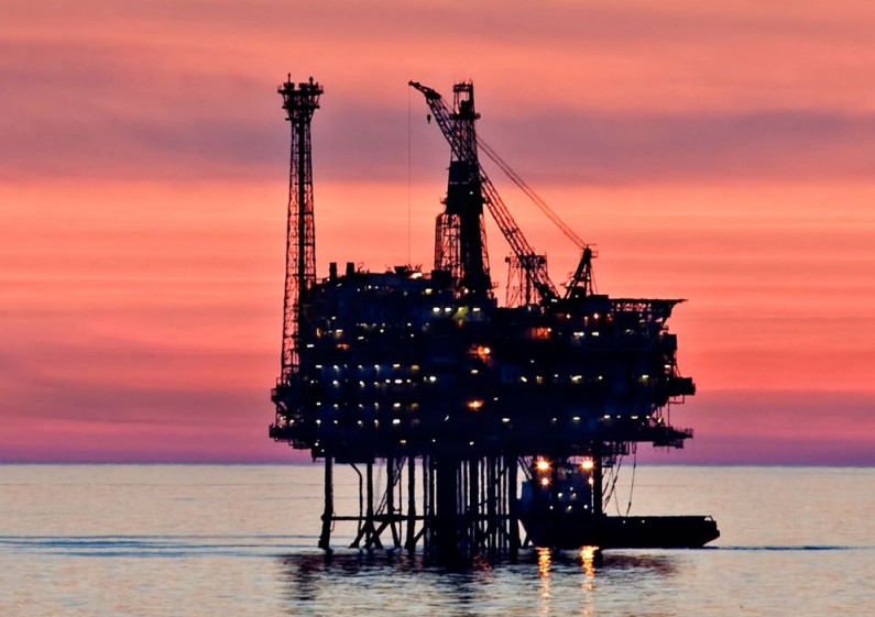 An offshore platform at sunset