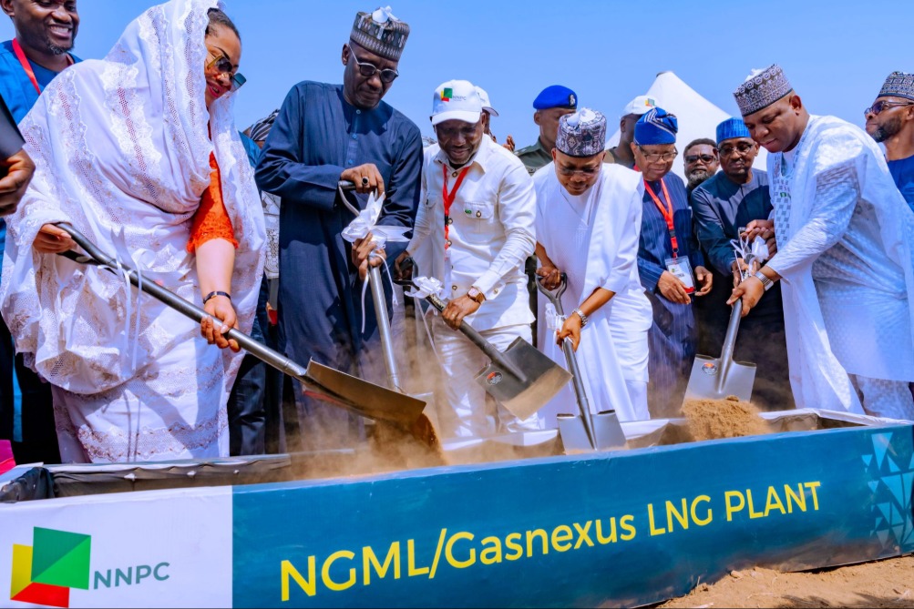 Several people shoveling dirt at a groundbreaking ceremony