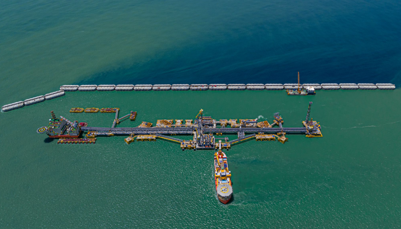 Aerial view of a large vessel and offshore infrastructure