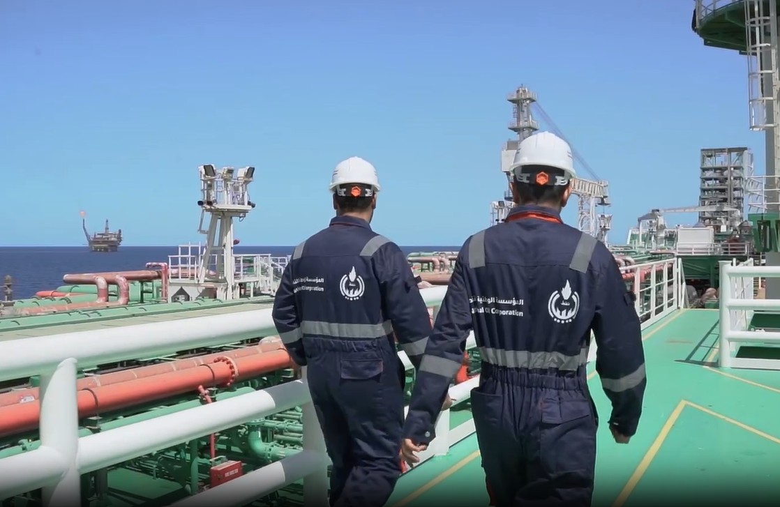 Two man walking on an offshore platform